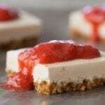 Easy no-bake vegan cheesecake bars with brown rice cereal crust and strawberry topping
